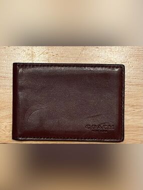 Coach Leather ID wallet in Dark Brown.